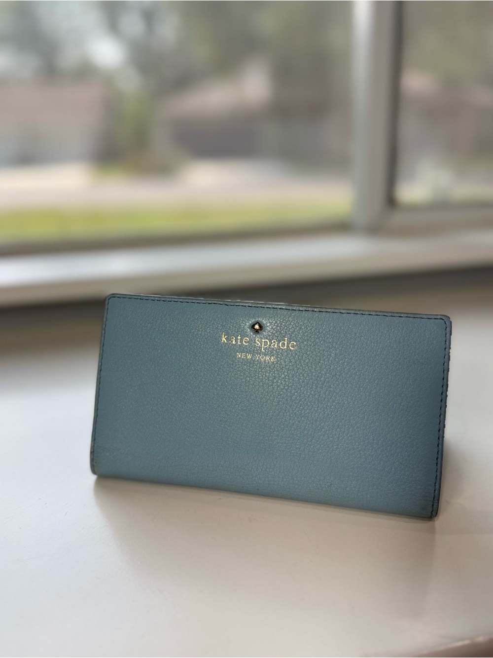 kate spade light teal leather continental wallet with gold logo